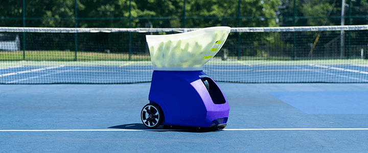 Spinfire Pro 2 Ball Machine set up on a tennis court