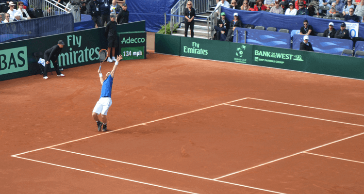 Andy Murray Hitting a Serve on Clay Courts for Davis Cup