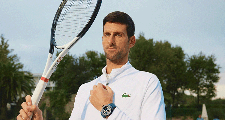 Novak Djokovic Holding His Racquet and Showcasing his Hubolt Watch