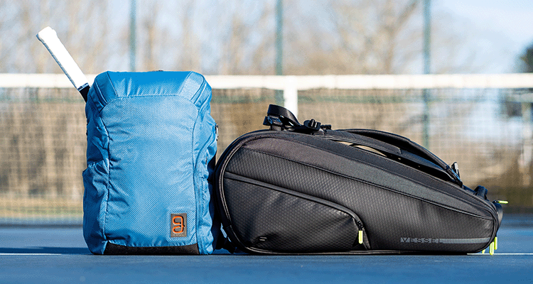 Geau Axiom Backpack v2 and Vessel Racquet Bag Sitting Side-by-Side on a Tennis Court