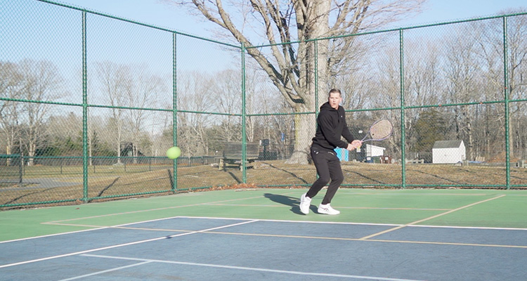 Jon Crim Hitting a Backhand Return with Luxilon 4G