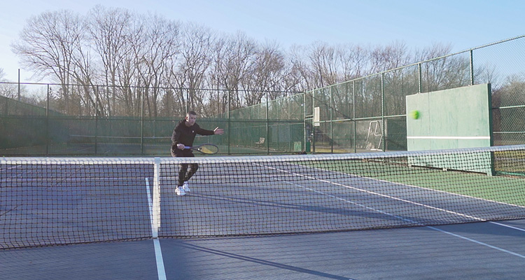 Jon Crim Hitting a Backhand Volley with Luxilon 4G